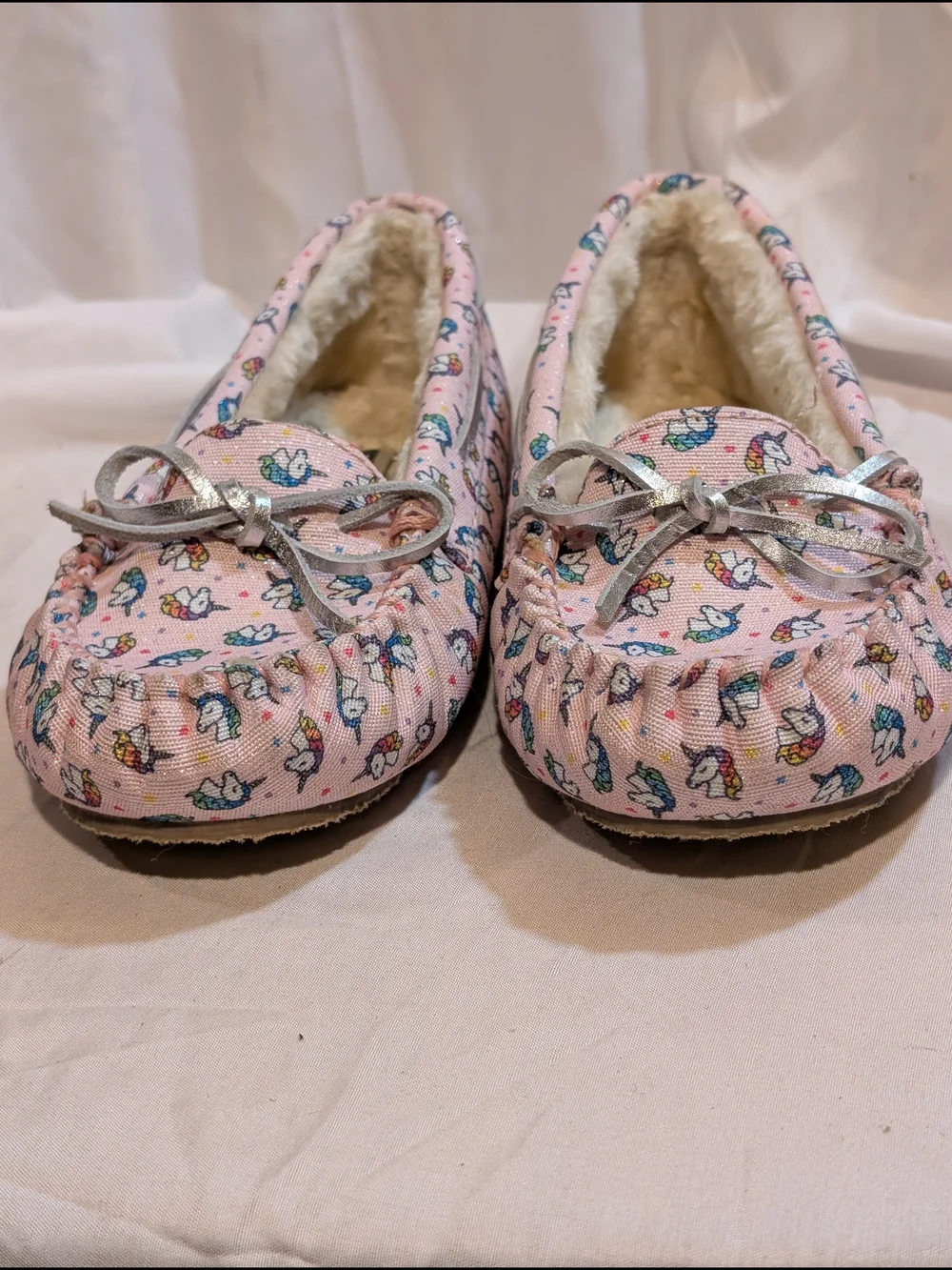 Minnetonka Pink Unicorn Print Moccasin Slippers with Silver Bow Accent